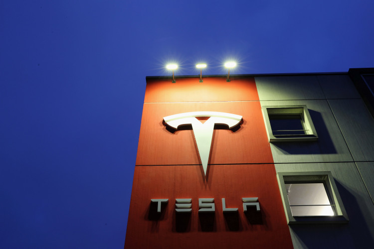 A logo of car manufacturer Tesla is seen at a branch office in Bern, Switzerland December 10, 2020