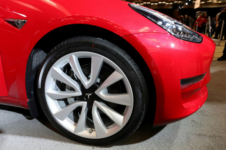 FILE PHOTO: A Tesla Model 3 electric vehicle is displayed at the Canadian International Auto Show in Toronto