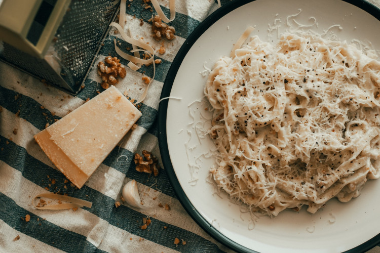 white pesto pasta with parmesan cheese