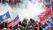  Tear gas is released into a crowd of protesters during clashes with Capitol police