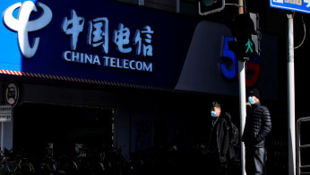 China telecommunications companies delisted from New York Stock Exchange