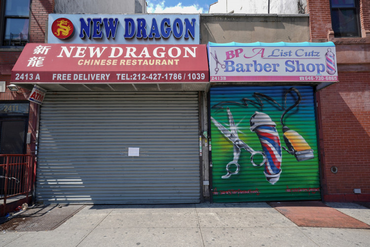 A Chinese restaurant and barber shop in Harlem are closed in New York City, New York