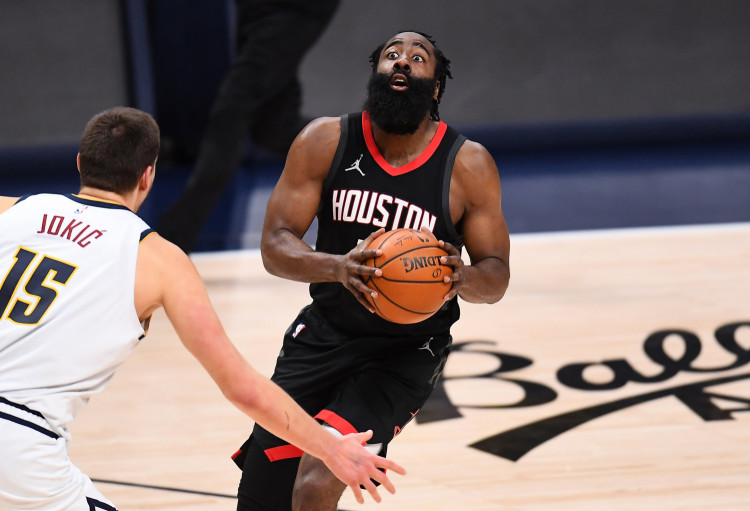 NBA: Houston Rockets guard James Harden (13) lines up a shot on Denver Nuggets center Nikola Jokic (15) in the third quarter at Ball Arena