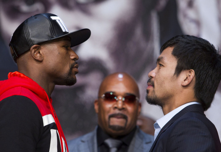 FILE PHOTO: Undefeated WBC/WBA welterweight champion Floyd Mayweather Jr of the U.S. and WBO welterweight champion Manny Pacquiao of the Philippines face off during a final news conference at the MGM Grand Arena in Las Vegas, Nevada