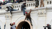 Supporters of U.S. President Donald Trump climb on walls at the U.S. Capitol 