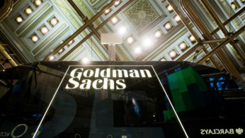 Goldman Sachs sign is seen above floor of the New York Stock Exchange.