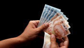 Turkish lira banknotes are seen in this picture illustration in Istanbul, Turkey.