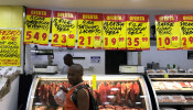 A costumer buys meat at a supermarket in Rio de Janeiro, Brazil.