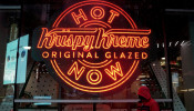 FILE PHOTO: A man walks past a Krispy Kreme 
