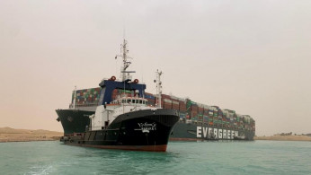 A container ship which was hit by strong wind and ran aground is pictured in Suez Canal,