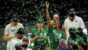 The Baylor Bears celebrate with the South Region trophy after beating the Arkansas Razorbacks.