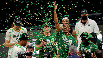 The Baylor Bears celebrate with the South Region trophy after beating the Arkansas Razorbacks.