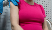 Pregnant woman receives a vaccine for the coronavirus disease (COVID-19) at Skippack Pharmacy in Schwenksville, Pennsylvania, U.S., February 11, 2021.