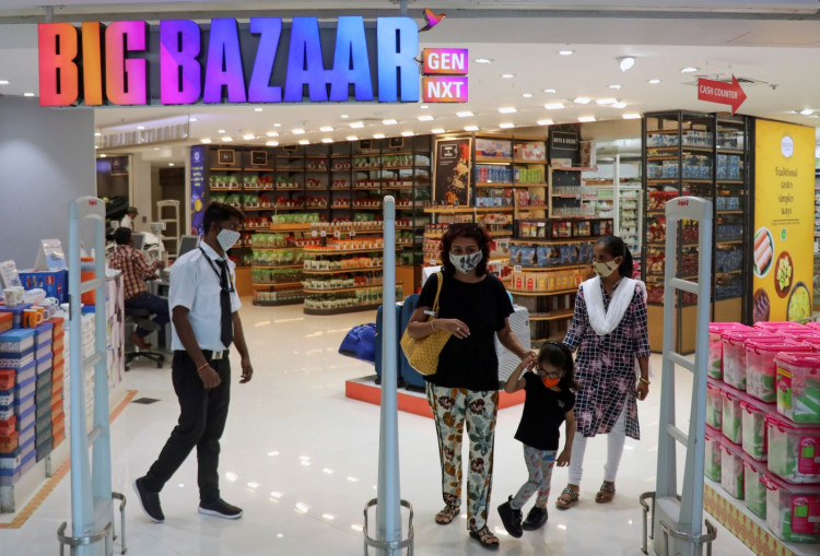 People exit the Big Bazaar retail store in Mumbai, India.