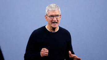 FILE PHOTO: CEO Tim Cook speaks at an Apple event at the company's headquarters in Cupertino, California, U.S. September 10, 2019. 