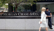 A woman walks past JPMorgan Chase & Co's international headquarters on Park Avenue in New York.