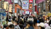 FILE PHOTO: Pedestrians wearing protective face masks, amid the coronavirus disease (COVID-19) pandemic