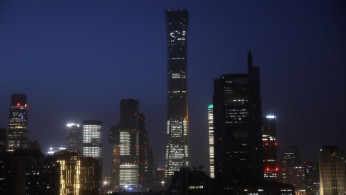 Buildings in the Central Business District (CBD) are seen lit up during the night in Beijing, China.