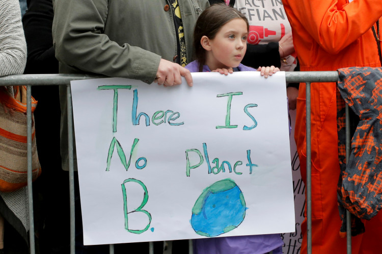 FILE PHOTO: Protesters line Central Park West during the Earth Day 'March For Science NYC' demonstration to coincide with similar marches globally in Manhattan, New York, U.S., April 22, 2017.