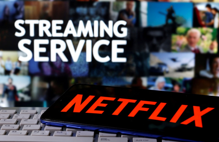 FILE PHOTO: A smartphone with the Netflix logo is seen on a keyboard in front of the displayed words "streaming service" in this illustration taken March 24, 2020. 