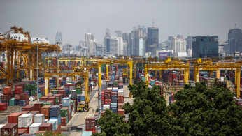 FILE PHOTO: Shipping containers stand at a port in Bangkok