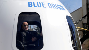 FILE PHOTO: Amazon and Blue Origin founder Jeff Bezos addresses the media about the New Shepard rocket booster and Crew Capsule mockup. 