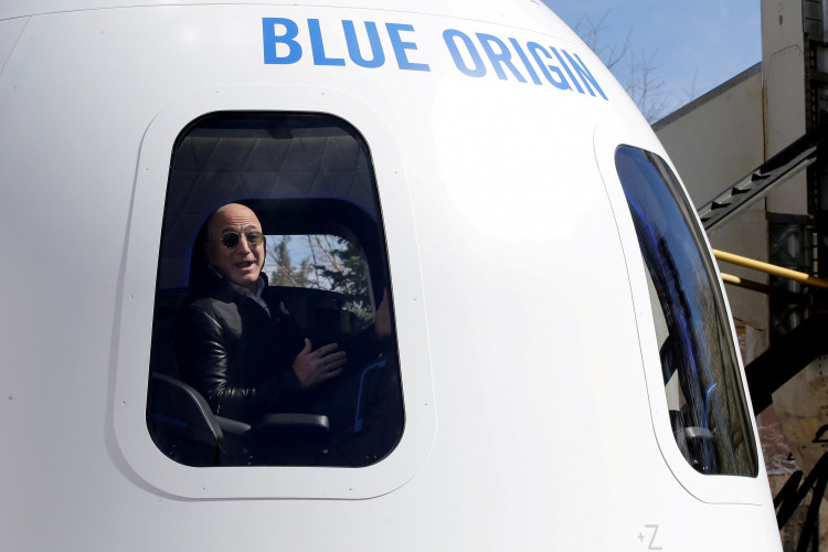 FILE PHOTO: Amazon and Blue Origin founder Jeff Bezos addresses the media about the New Shepard rocket booster and Crew Capsule mockup. 