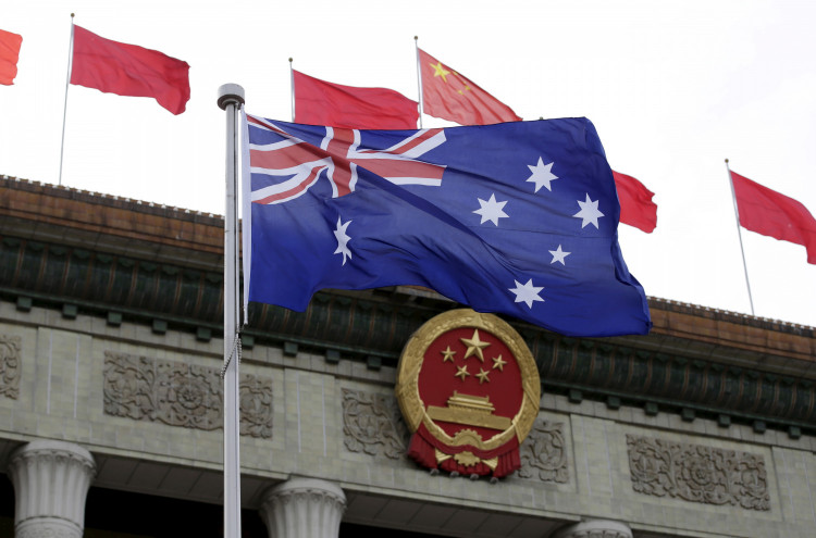 FILE PHOTO: Australian flag flutters in front of the Great Hall of the People during a welcoming ceremony for Australian Prime Minister Malcolm Turnbull (not in picture) in Beijing, China, April 14, 2016. 