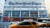 FILE PHOTO: Vehicles drive past the New York Times headquarters in New York March 1, 2010. 