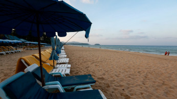 FILE PHOTO: Empty chairs are seen on a beach which is usually full of tourists, amid fear of coronavirus in Phuket, Thailand March 11, 2020. 
