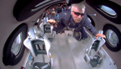 Billionaire Richard Branson floats in zero gravity above Spaceport America