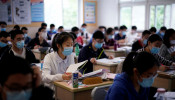 Students wearing face masks are seen inside a classroom 