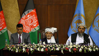 Afghan president in urgent talks as Taliban take key town near Kabul
