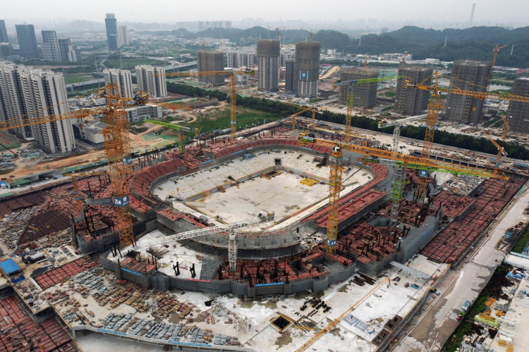 China asking state-backed firms to pick up Evergrande assets - sources