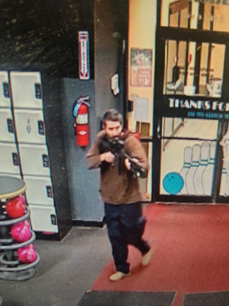 Maine Shooting Suspect's Ties to Biden Conspiracy Fuels Cross-Border Manhunt