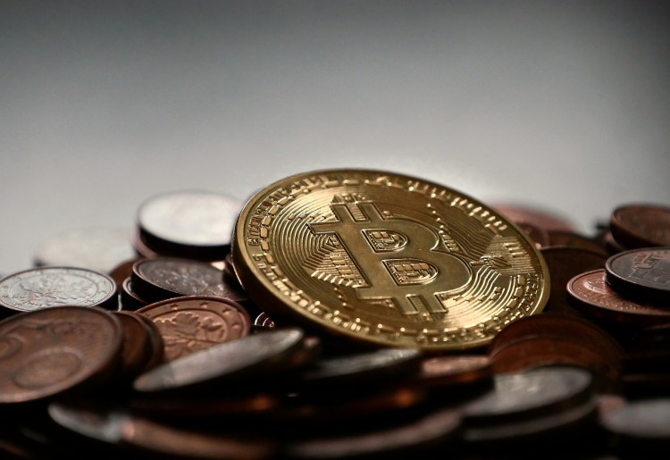 Bitcoin Sinks Below $57K Amid Market Jitters and ETF Outflows as Fed Concerns Mount