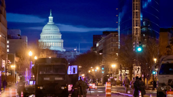 Capitol riot violence denial sparks firm response from Newsmax host during panel discussion.