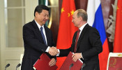 China’s Xi Arrives in Moscow Amid Drone Strikes, Trade War, and Calls for U.S. 'De-Americanization'