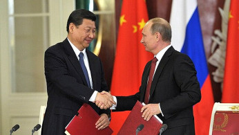 China’s Xi Arrives in Moscow Amid Drone Strikes, Trade War, and Calls for U.S. 'De-Americanization'