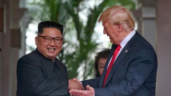 U.S. President Donald Trump and North Korea's leader Kim Jong Un shake hands
