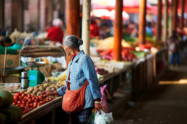 Old woman shopping in market