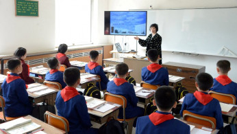 Students attend a class as the new school year begins in North Korea in this photo released by Korean Central News Agency (KCNA) April 2, 2018. KCNA/via Reuters/File Photo
