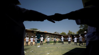 Palestinian children play at their school which began studies earlier this year, in the Bedouin village of Khan al-Ahmar that Israel plans to demolish, in the occupied West Bank