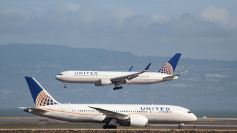 A United Airlines aircraft taxis as another lands at San Francisco International Airport, San Francisco, California