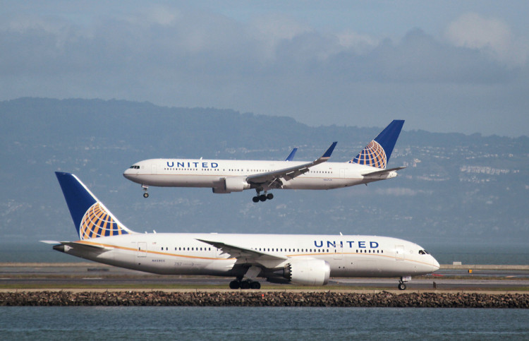 A United Airlines aircraft taxis as another lands at San Francisco International Airport, San Francisco, California