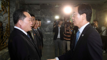 South Korean Unification Minister Cho Myoung-gyon andNorth Korean counterpart Ri Son Gwon