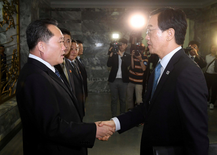 South Korean Unification Minister Cho Myoung-gyon andNorth Korean counterpart Ri Son Gwon