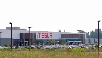 Cars are parked outside the Tesla Inc. Gigafactory 2, which is also known as RiverBend, a joint venture with Panasonic to produce solar panels and roof tiles in Buffalo, New York