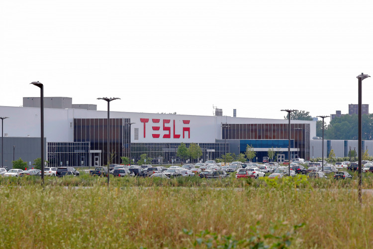 Cars are parked outside the Tesla Inc. Gigafactory 2, which is also known as RiverBend, a joint venture with Panasonic to produce solar panels and roof tiles in Buffalo, New York