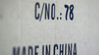 Words 'Made in China' are pictured on a box of products imported from China at a wholesale shop in Paris